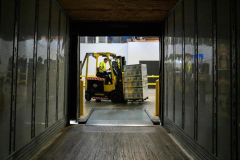 forklift in view from inside freight truck